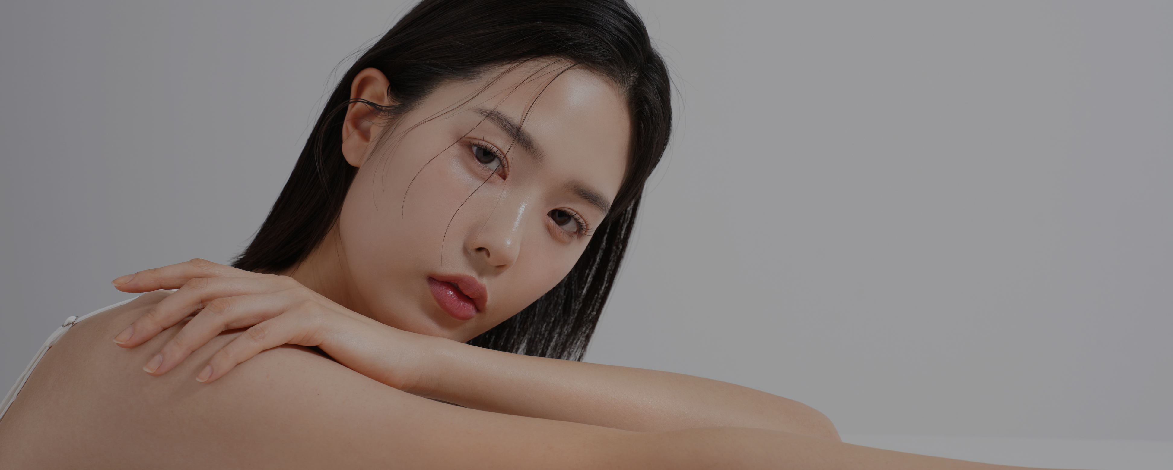 Woman with glowing skin representing premium skincare